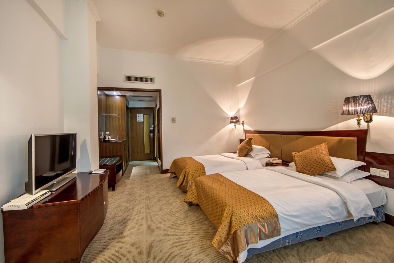 Baodao Exhibition Center Hotel Wuyishan  Bagian luar foto